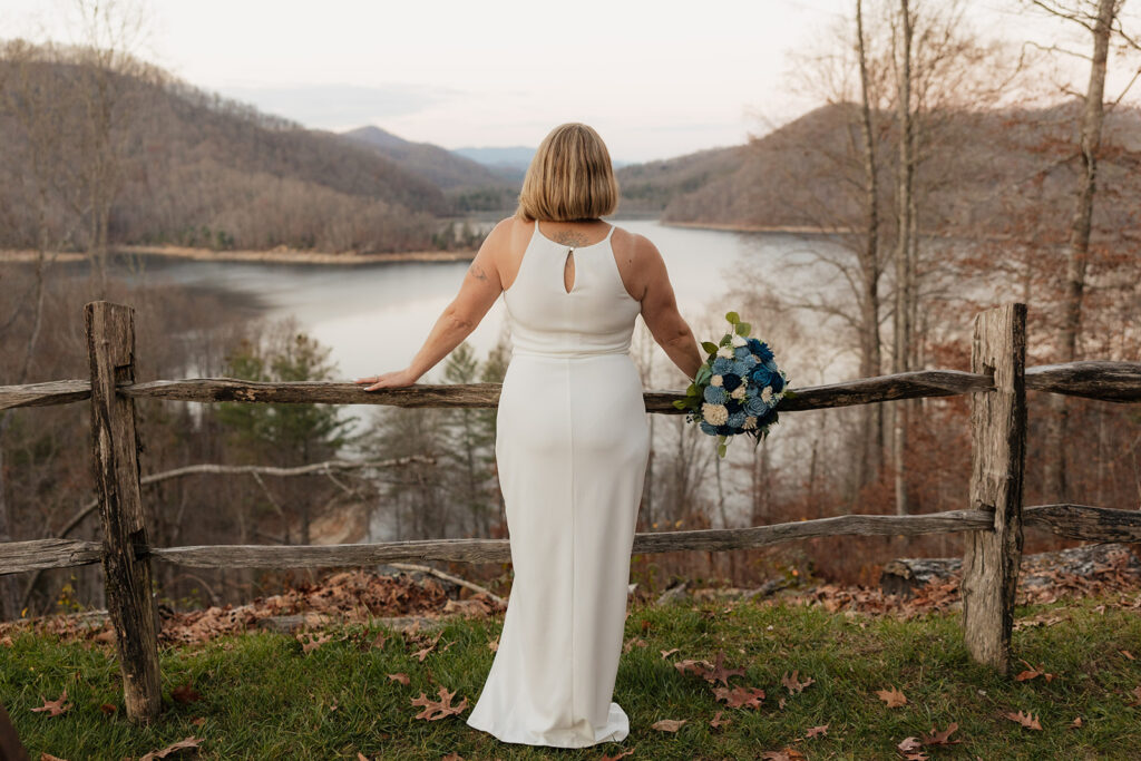 Destination elopement photographer captures bride looking over mountains during Smoky Mountain elopement