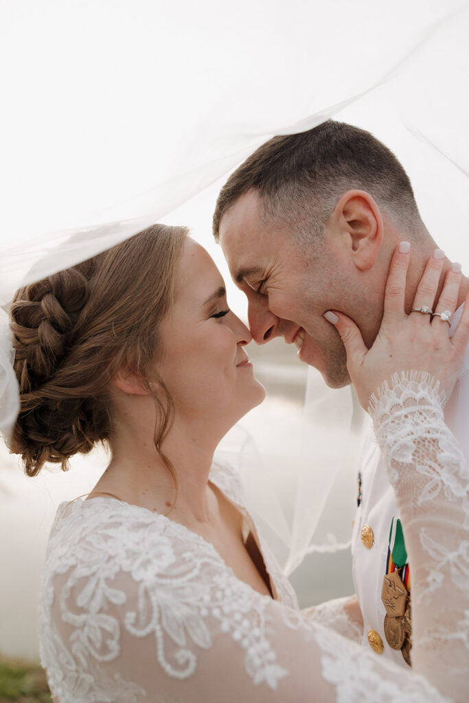 Destination elopement photographer captures bride and groom touching noses during bridal portraits after Tennessee elopement