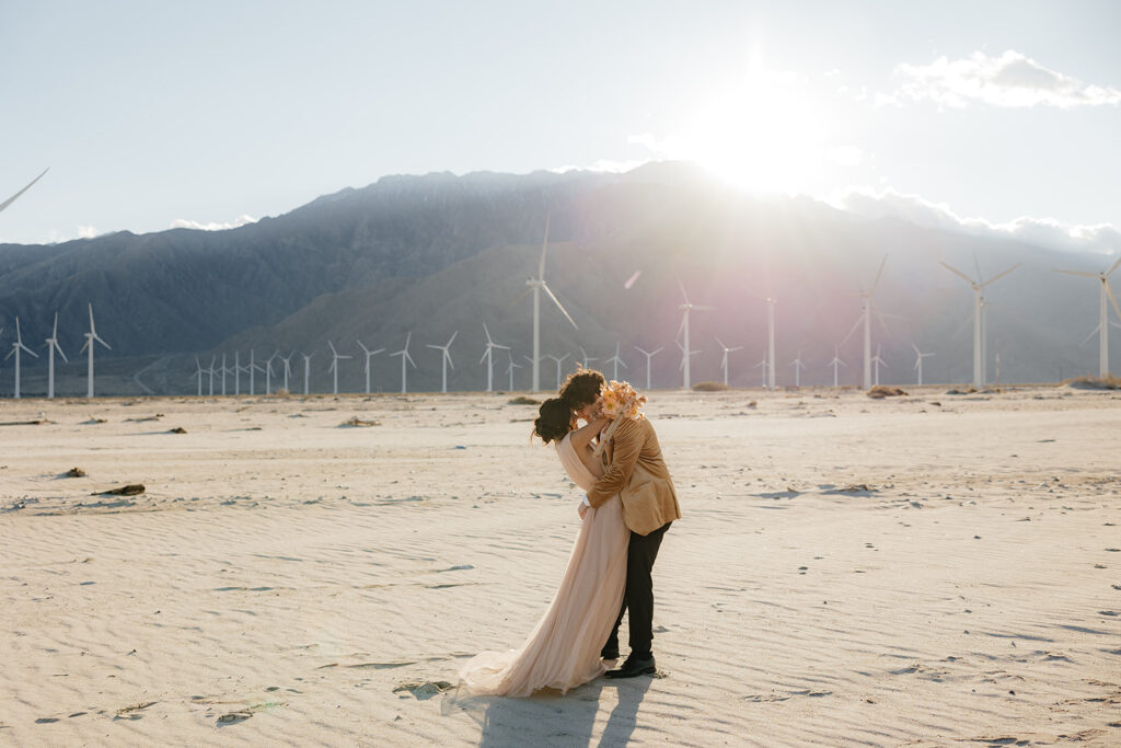 Destination elopement photographer captures bride and groom kissing 