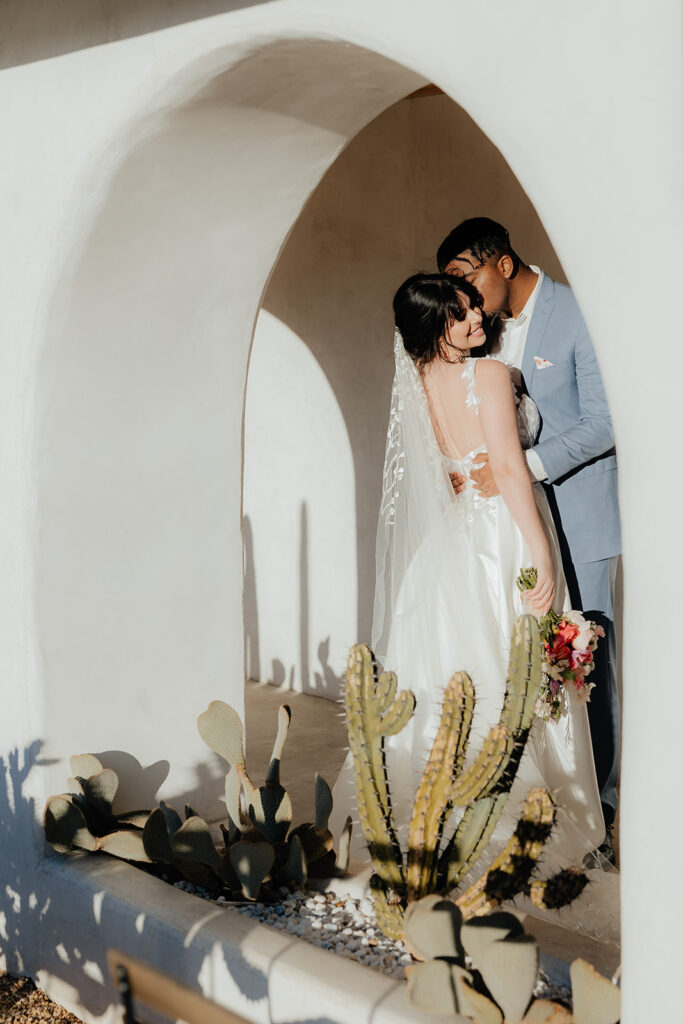 Destination elopement photographer captures bride and groom kissing after Las Vegas elopement