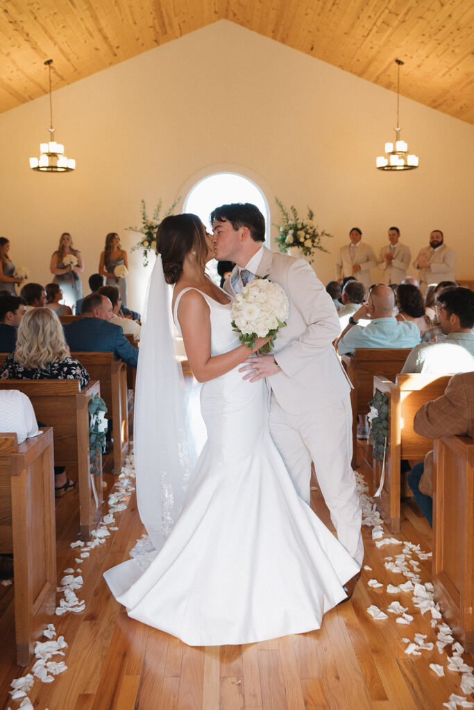 Tennessee wedding photographer captures bride and groom kissing after wedding ceremony