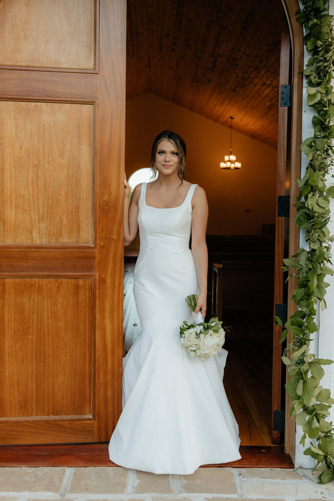 Tennessee wedding photographer captures bride standing in chapel before wedding