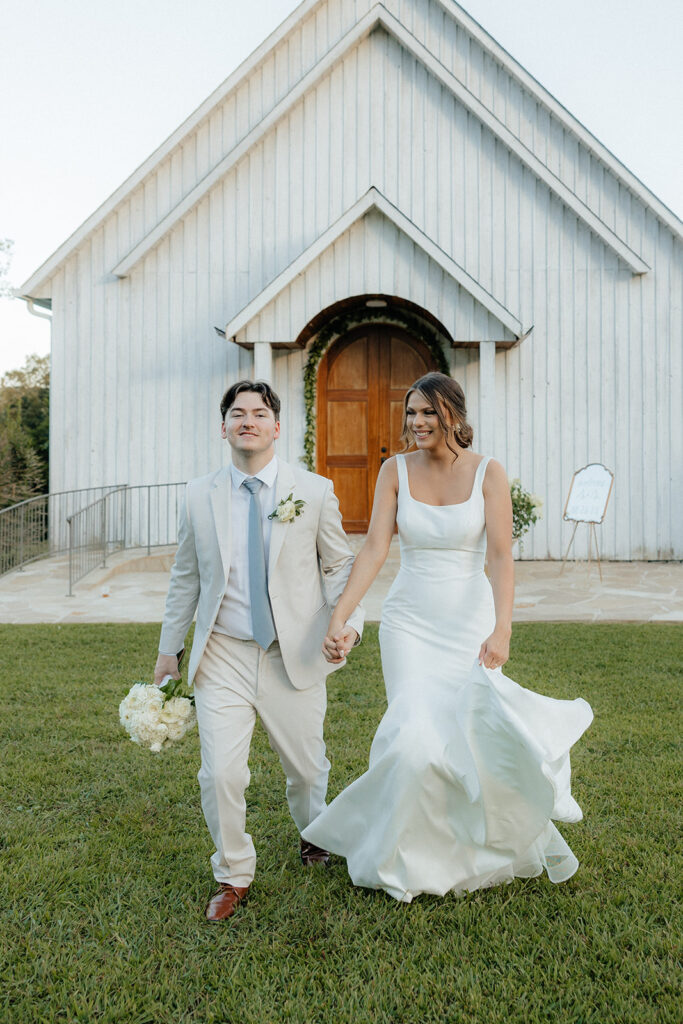 Tennessee wedding photographer captures bride and groom walking hand in hand after Tennessee wedding