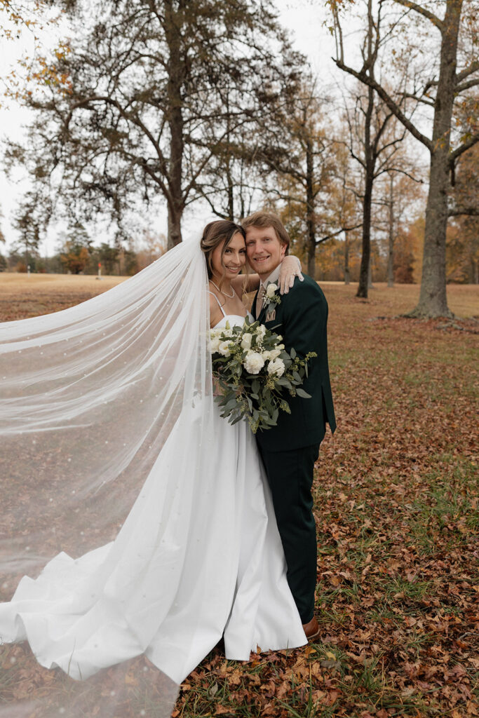 Destination elopement photographer captures bride and groom embracing during outdoor bridal portraits