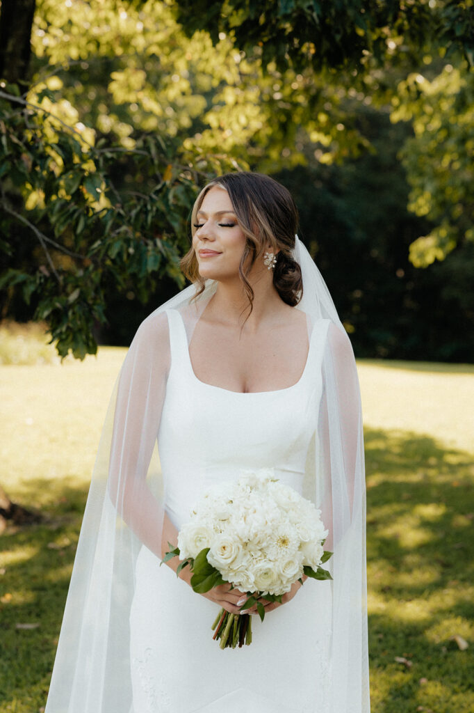 Tennessee wedding photographer captures bride looking away holding wedding bouquet