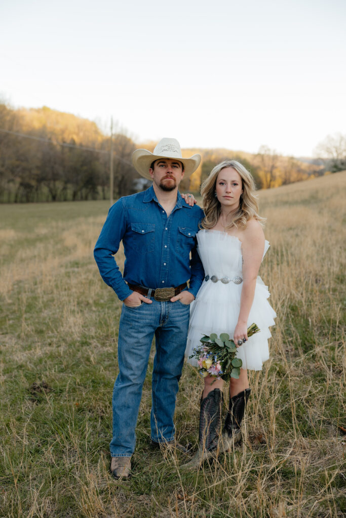 Western themed engagement session with cowboy boots and florals