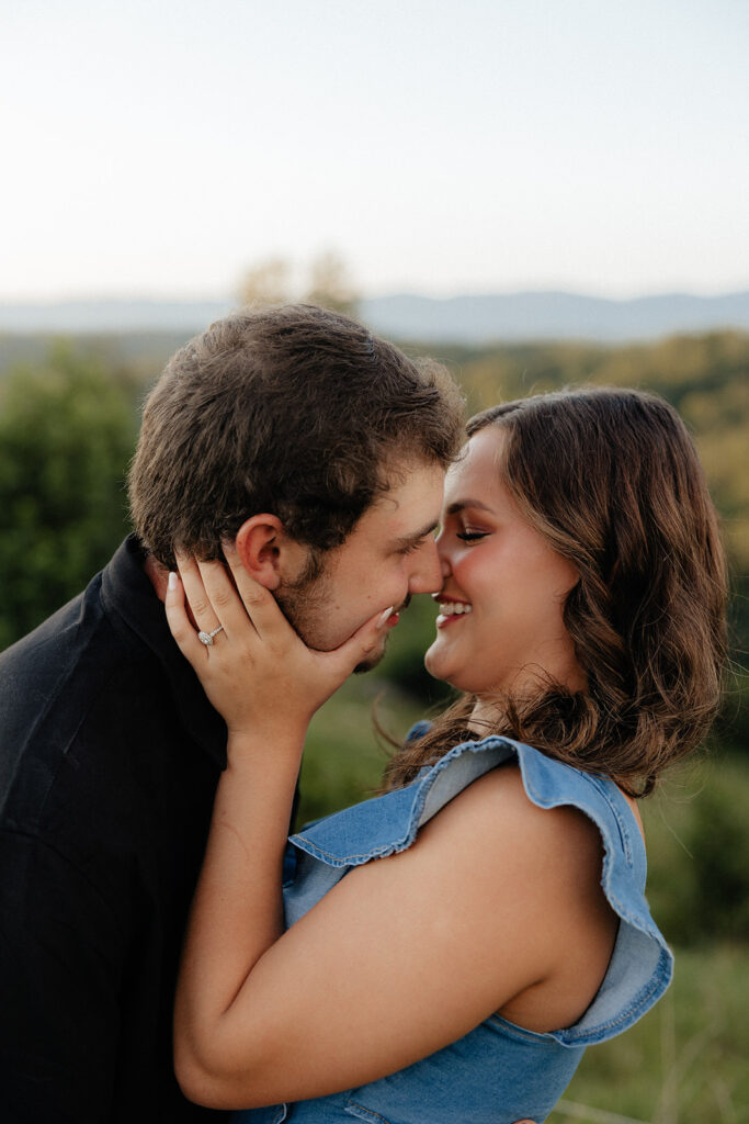 Tennessee elopement photographer captures man and woman embracing and about to kiss during mountain engagement photos