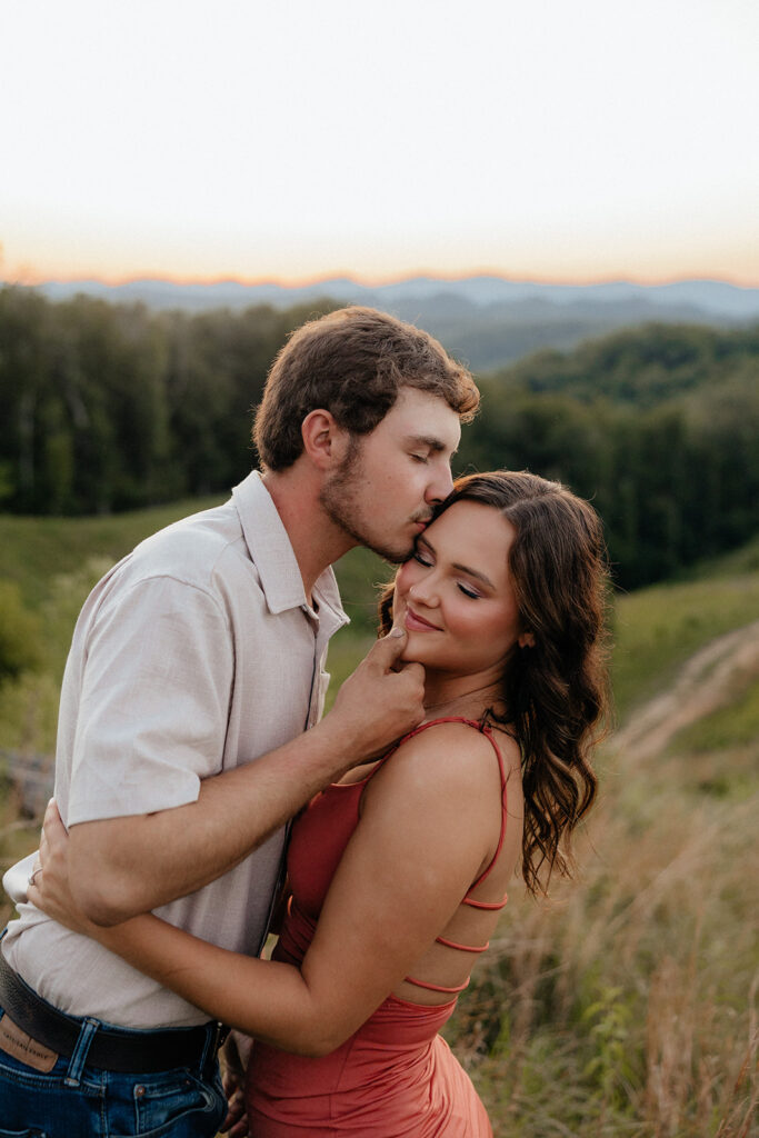 Tennessee elopement photographer captures man kissing womans forehead