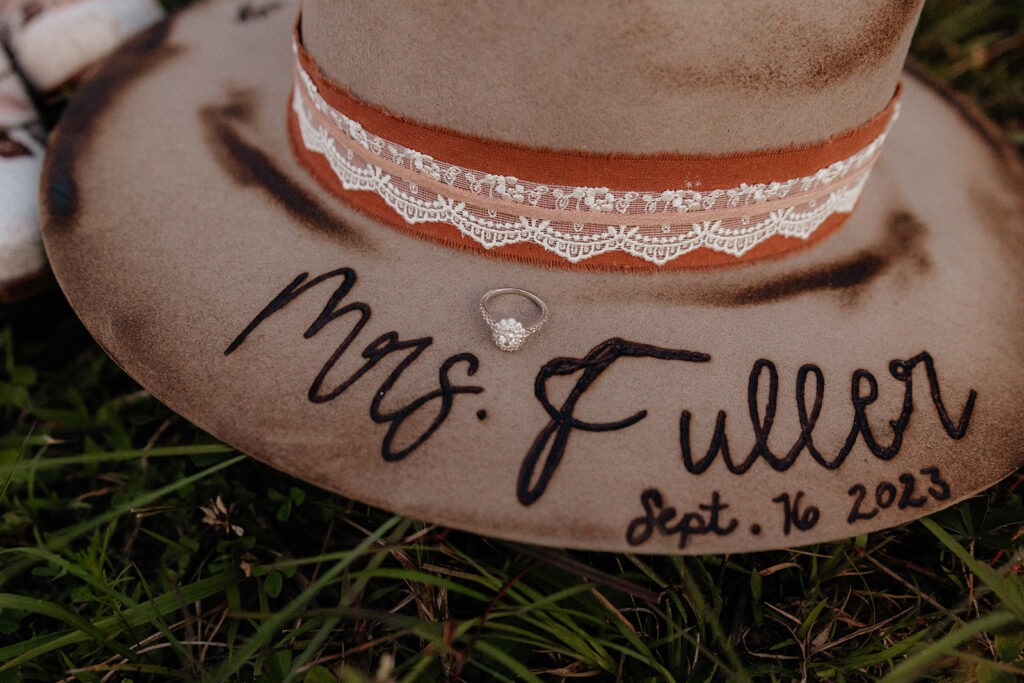 Tennessee elopement photographer captures close up of woman's hat with future married name burned into hat